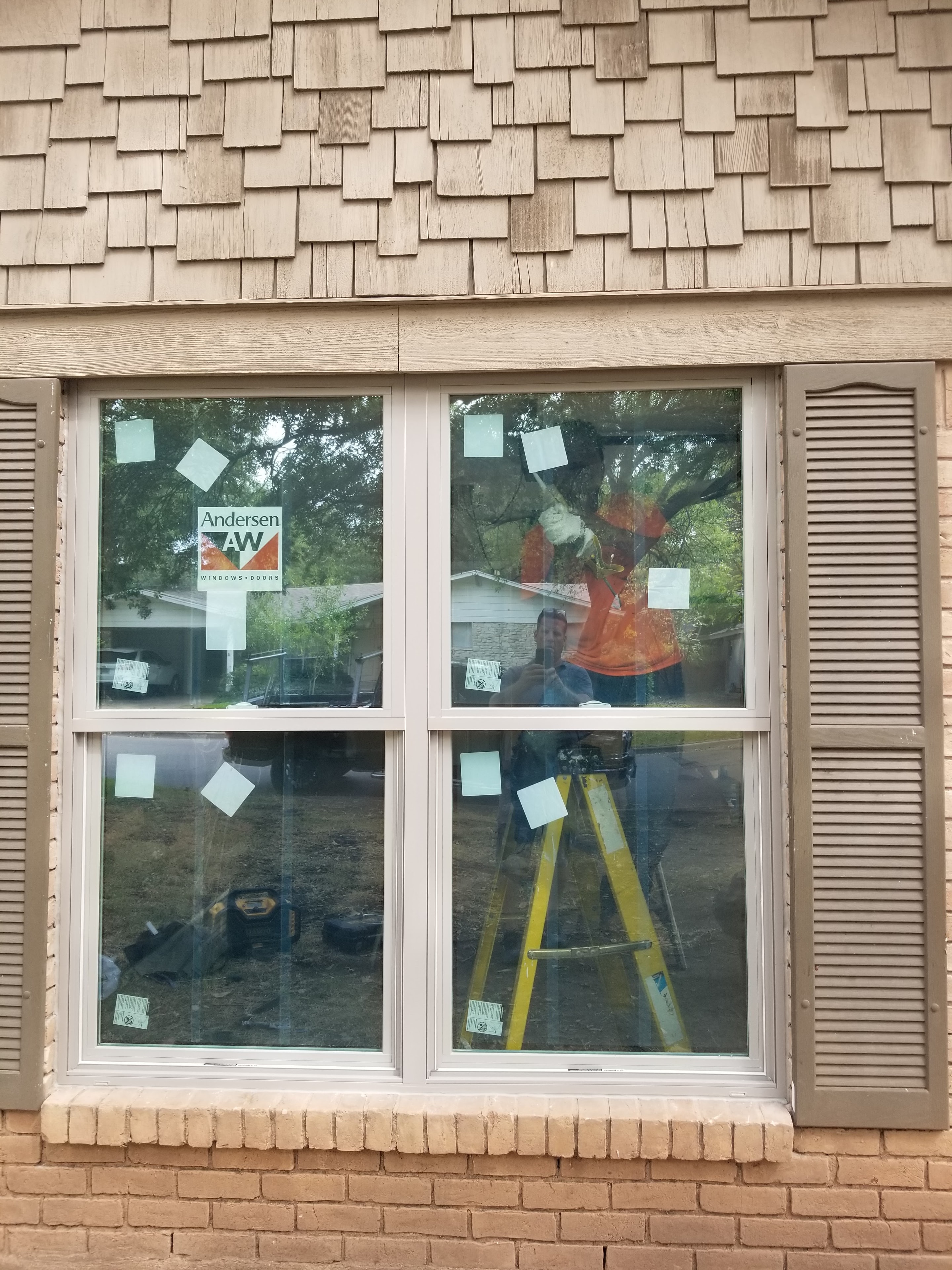 Andersen double-hung windows installed on home with wood shingle siding