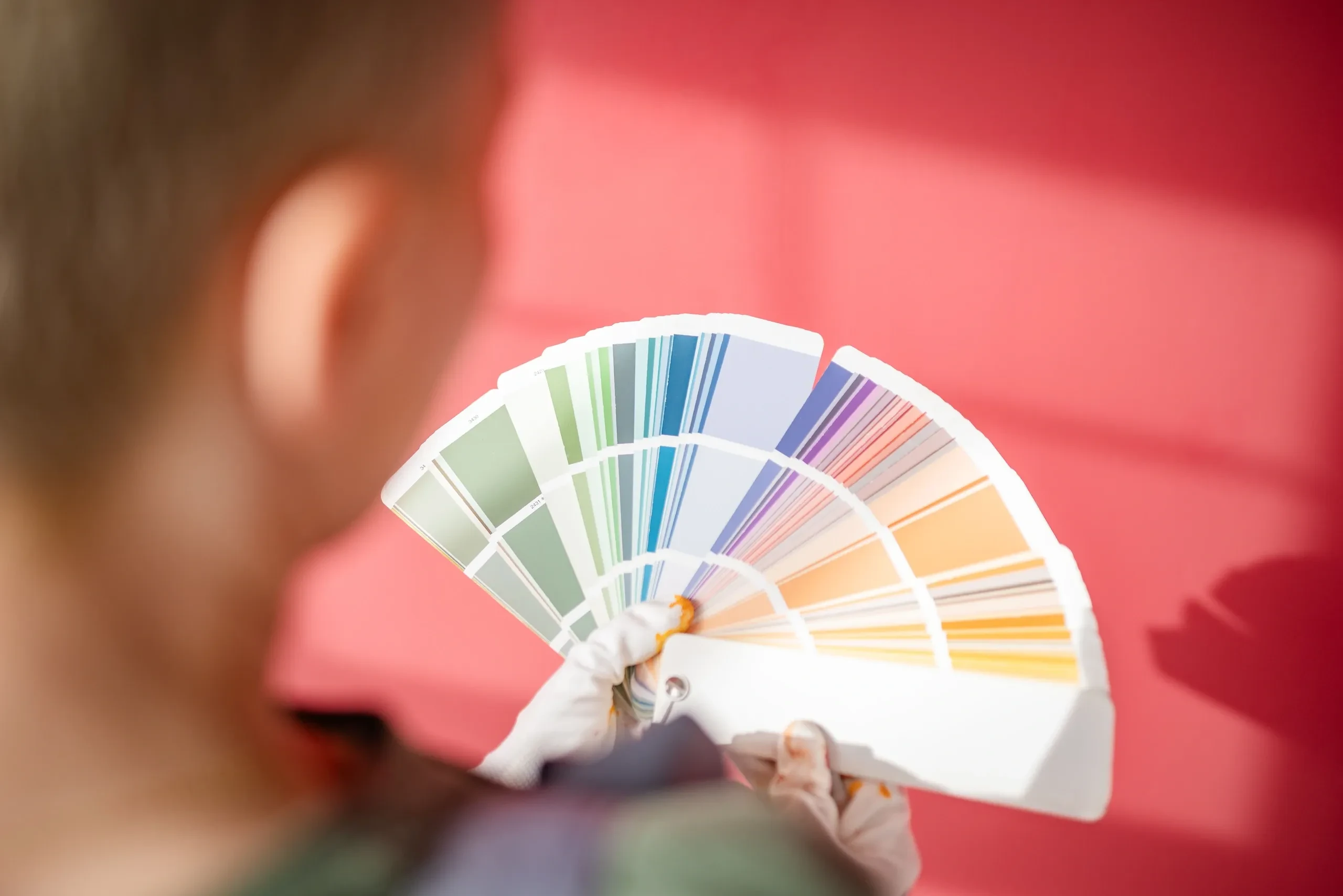 Painter reviewing color swatches for home interior